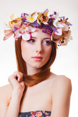 portrait of a young redhead girl with flower wreath