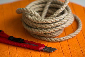 Coarse rope roll and a knife with
