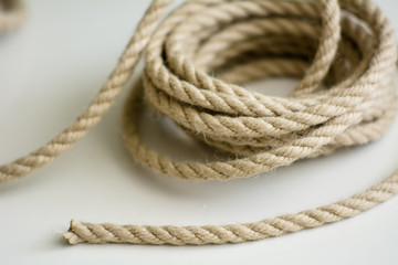 Coarse rope roll on a white surface