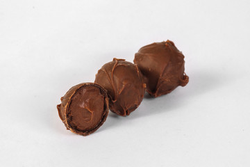 Chocolate truffles on white background