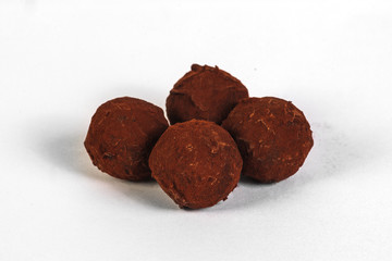 Chocolate truffles on white background