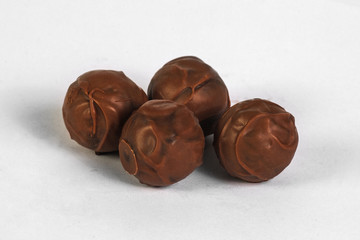 Chocolate truffles on white background
