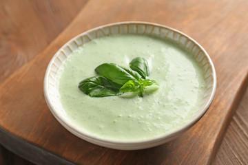 Tasty creamy sauce for fish taco in bowl on wooden table