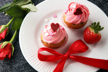 Delicious cupcake for Valentine Day. cake for Valentines day with chocolate and strawberries. Traditional homemade with red roses