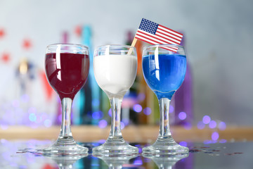 Cocktails in colors of American flag on table