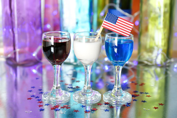 Cocktails in colors of American flag on table