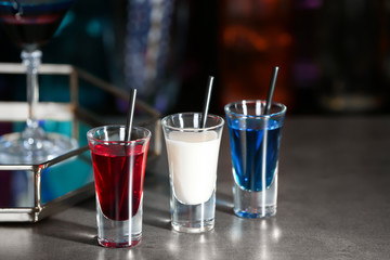 Cocktails in colors of American flag on table