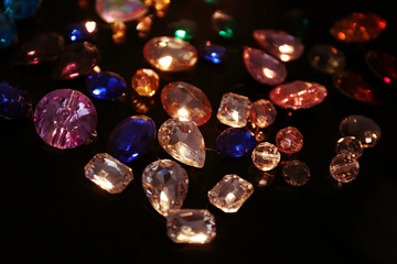 Colorful precious stones for jewellery on dark background