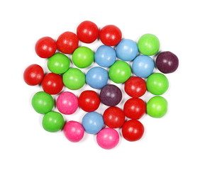 Colorful candies isolated on white background, top view