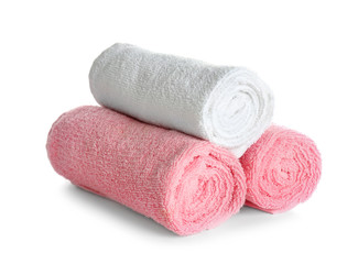 Rolled clean towels on white background. Laundry day