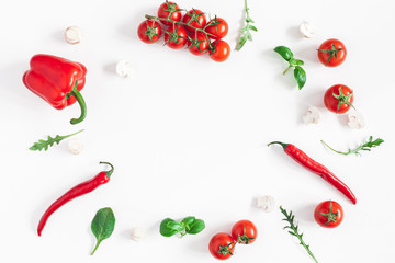 Vegetables on white background. Frame made of fresh red vegetables. Tomatoes, peppers. Flat lay, top view, copy space