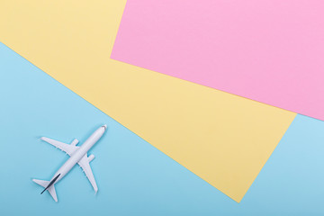 White blank model of passenger airplane on serenity colored paper texture