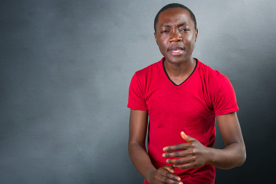 Closeup portrait of easy going clueless young man, student arms out asking what's the problem