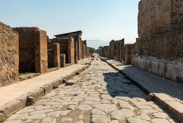 An ancient cobbled street in the ruins of Pompeii, Italy.