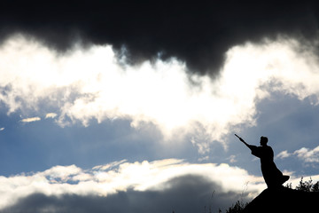 Silhouette monk on the mountain prayer moses faith god