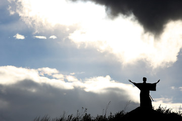 Silhouette monk on the mountain prayer moses faith god