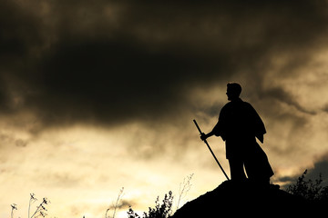 Fighter with a sword silhouette a sky ninja