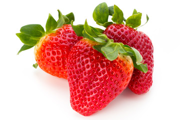 Fresh strawberries close up on white background.