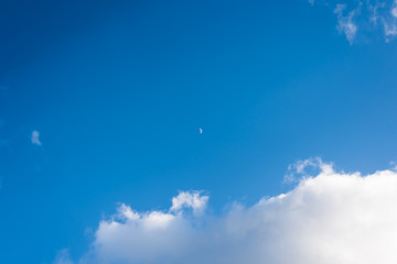 Beautiful blue sky with sparse clouds