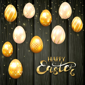 Happy Easter and golden eggs on black wooden background