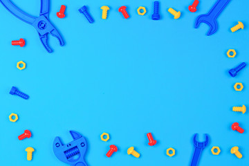 Kids Toys Top View. Colorful Toy Tools on Blue Background