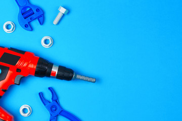 Toys background. Toy tools on blue background. Top view