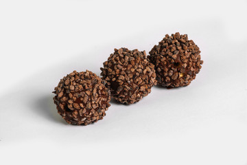 Chocolate truffles on white background