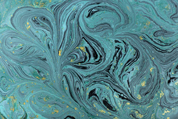 Marble abstract acrylic background. Nature blue marbling artwork texture. Golden glitter.