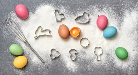 Cookies ingredients colored eggs Easter food background
