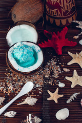 Blue ice cream in coconut bowl.