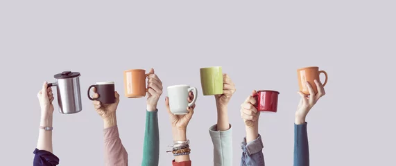  Many different arms raised up holding coffee cup © sebra