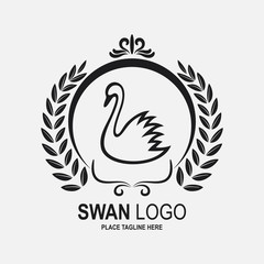 Obraz premium Swan icon design template. Black swan and laurel wreath in round frame