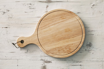 Wooden chopping board on wooden background
