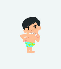 Asian boy in a swimsuit ponders, something angry.