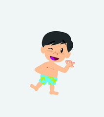 Asian boy in a swimsuit doing the OK sign with his hand.