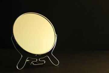 Make up mirror, black background, free copy space