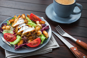 fresh chicken salad with blue coffee cup