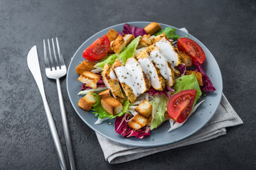 fresh salad with grilled chicken, tomato