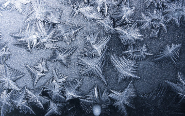 Background - beautiful ornaments on frozen window