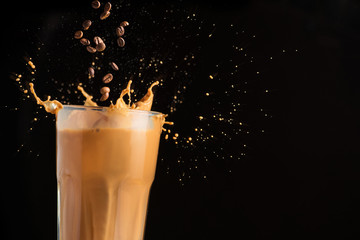 Iced latte coffee glass with splash