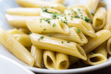 close-up of plate of pasta with lettuce