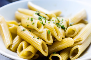 close-up of plate of pasta with lettuce