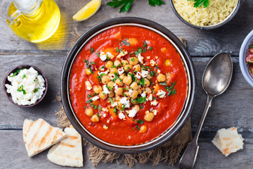 Chickpea soup. Moroccan traditional dish. Wooden background. Top view.