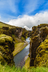 Fjadrargljufur canyon steep cliffs and waters of Fjadra river, south Iceland