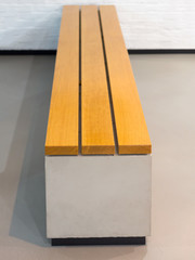 Brown bench for visitors in a museum or exhibition hall