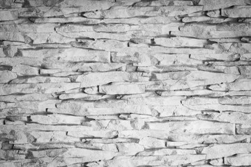 Grey, granulary and grunge stone wall background
