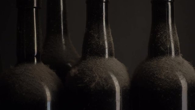 Old wine bottles close-up. Moving light