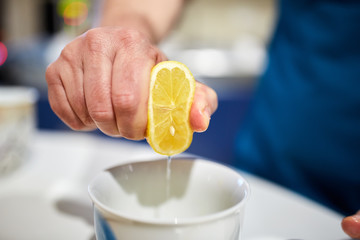 Hand squeezing lemon