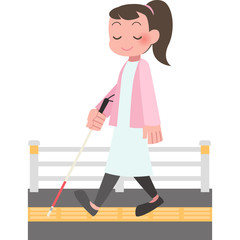 白杖をついて歩く女性