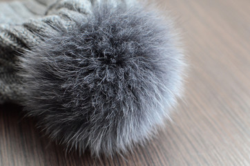 Gray fluffy pompon